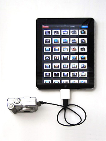 専用オプションのiPad Camera Connection Kitに含まれるUSBケーブルドングルを利用してデジタルカメラを接続したところ。自動的に、カメラ内のイメージデータの読み込みモードとなり、画面にサムネールが表示されるので、すべて、もしくは選択したイメージのみをiPad内に転送できる